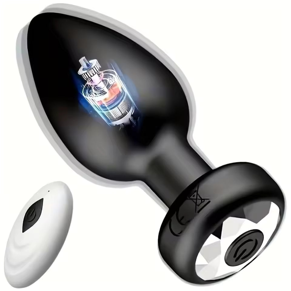 Black vibrating butt plug showing internal motor, gem base, and white wireless remote control.